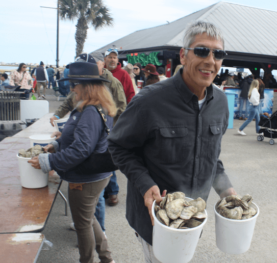 Man with oyster buckets reduced-Hammock-Coast-South-Carolina